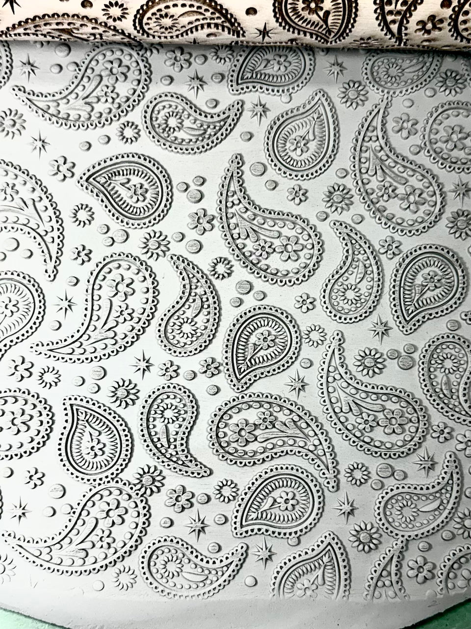 Coordinating pattern of Embossed clay with paisley design 